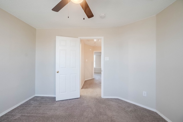 carpeted empty room with ceiling fan