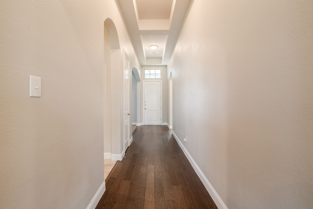 hall with dark hardwood / wood-style flooring