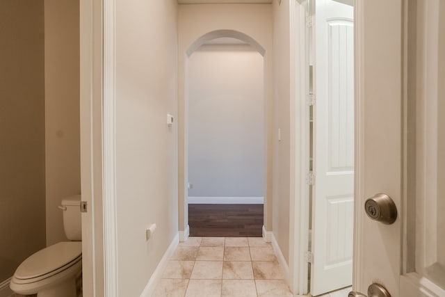 bathroom with tile patterned flooring and toilet