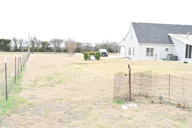 view of yard with central AC