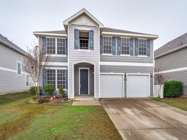 view of front facade featuring a garage and a front yard