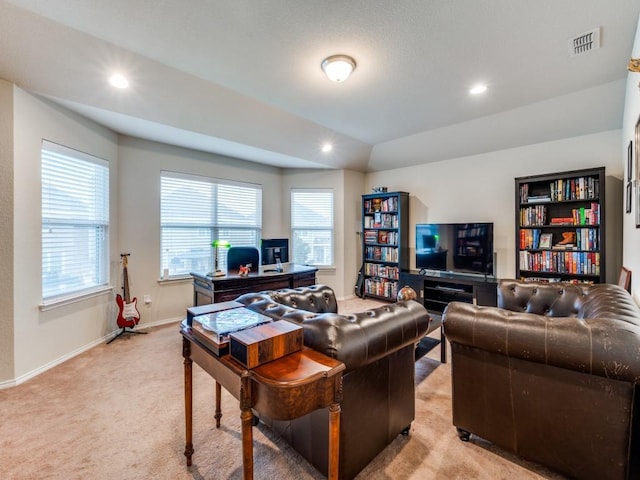 living room with light carpet and vaulted ceiling