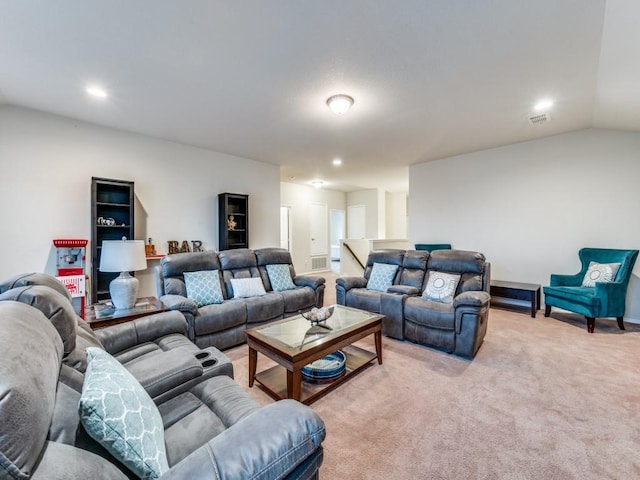 carpeted living room with lofted ceiling