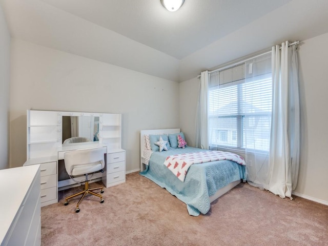 carpeted bedroom featuring vaulted ceiling