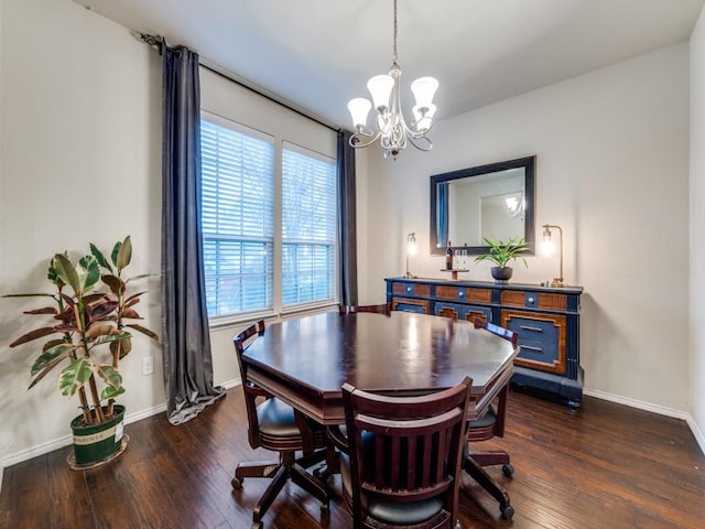 dining room featuring dark hardwood / wood-style floors, an inviting chandelier, and plenty of natural light