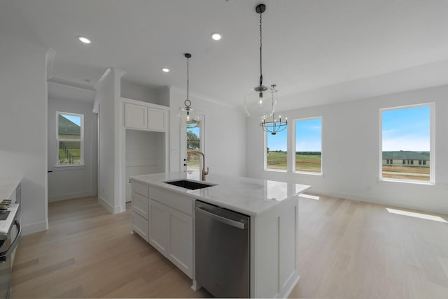 kitchen featuring white cabinets, dishwasher, sink, and an island with sink