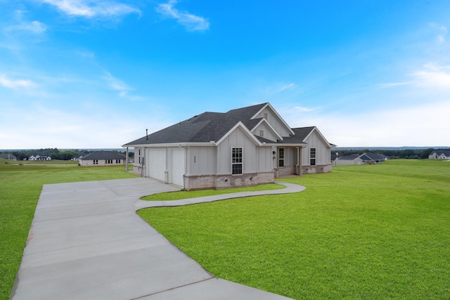 view of front of property with a garage and a front lawn