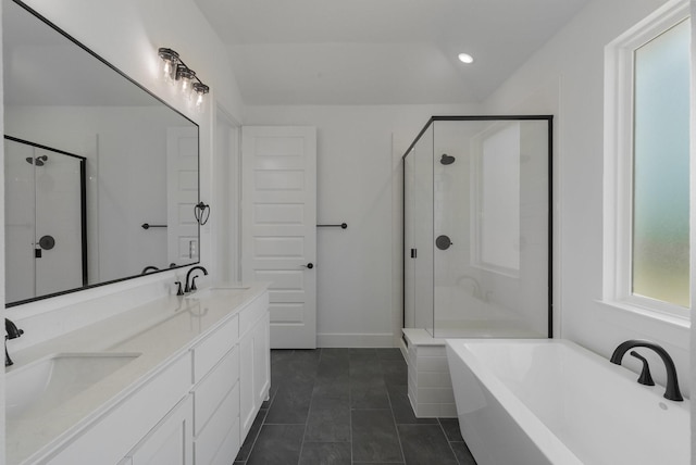 bathroom featuring plus walk in shower, tile patterned floors, and vanity