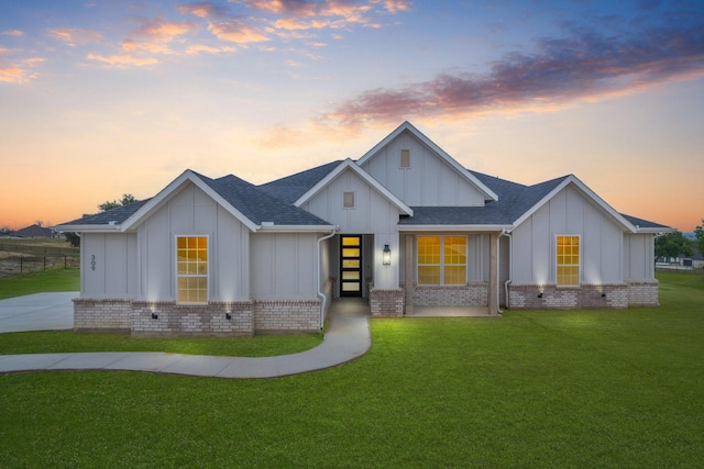 view of front of home with a lawn