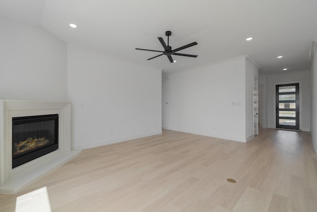 unfurnished living room with ceiling fan and light hardwood / wood-style flooring