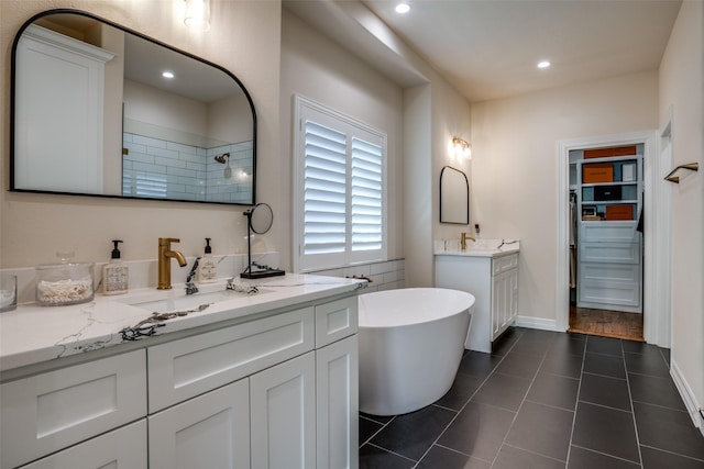 bathroom featuring tile patterned floors, vanity, and separate shower and tub