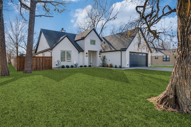 view of front of house with a front lawn and a garage