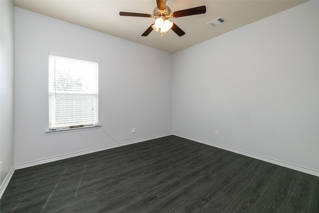 unfurnished room featuring dark hardwood / wood-style floors and ceiling fan