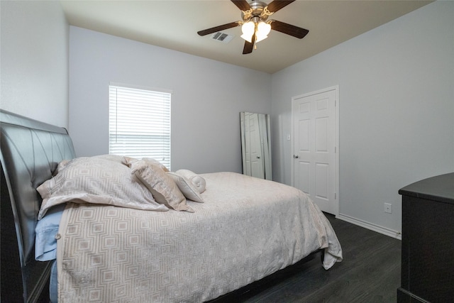 bedroom featuring dark wood-type flooring and ceiling fan