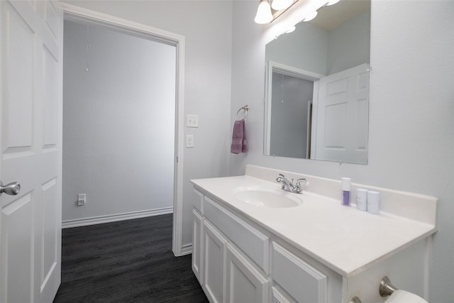 bathroom featuring hardwood / wood-style flooring and vanity