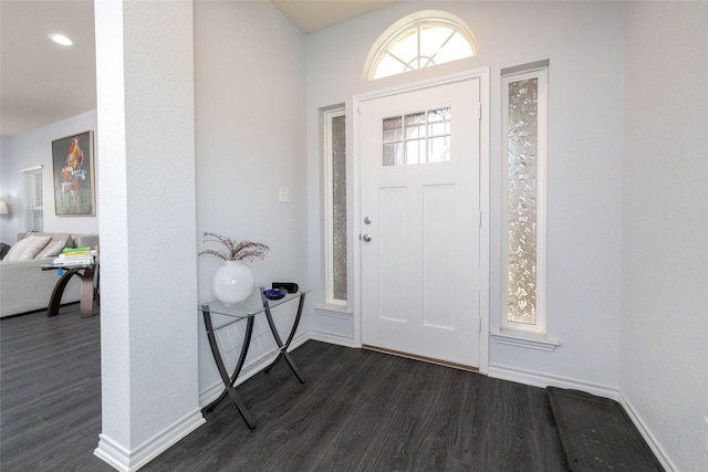 entrance foyer with dark hardwood / wood-style floors