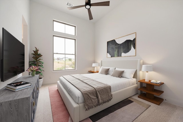 carpeted bedroom featuring high vaulted ceiling and ceiling fan