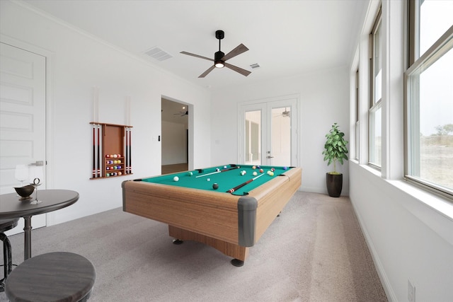 playroom with french doors, ornamental molding, light colored carpet, ceiling fan, and billiards