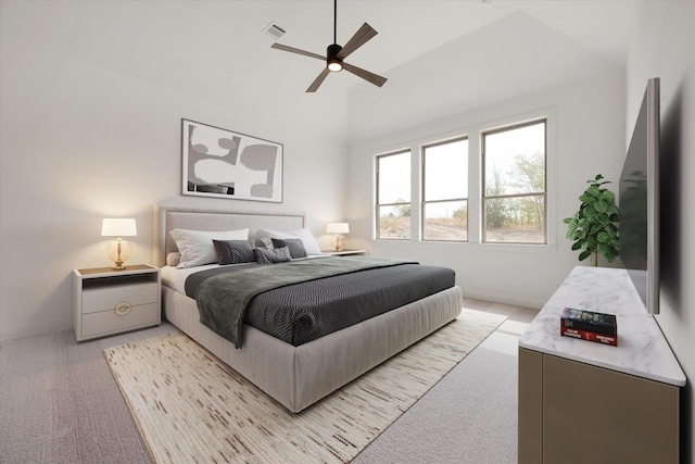 bedroom with ceiling fan, light colored carpet, and lofted ceiling