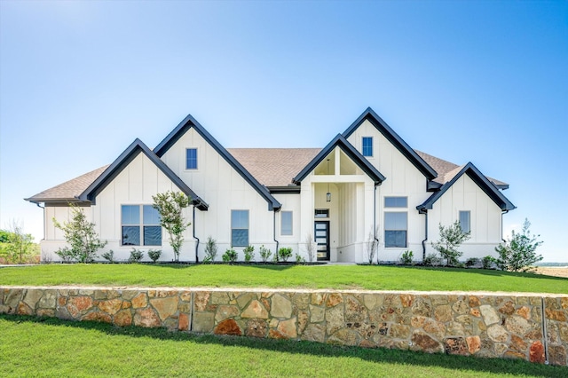 modern inspired farmhouse with a front yard