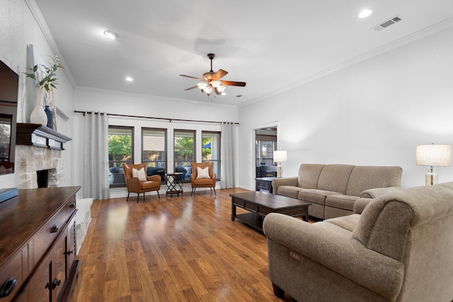 living room featuring crown molding, ceiling fan, and light wood-type flooring