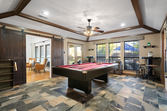 game room with a barn door, ceiling fan, and pool table