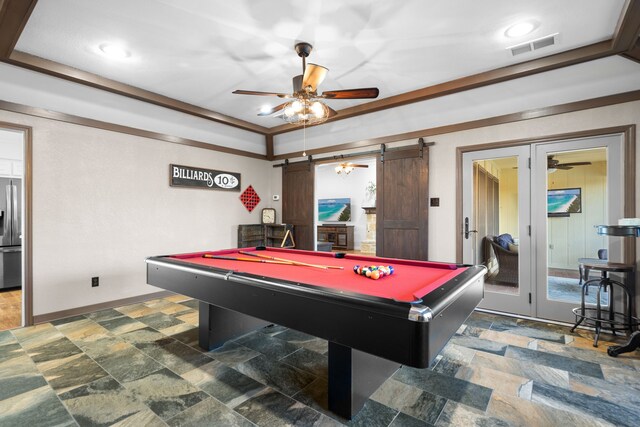 game room with a barn door, ceiling fan, and pool table