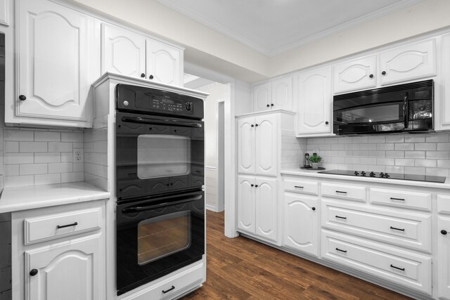 kitchen with backsplash, white cabinetry, dark hardwood / wood-style flooring, and black appliances