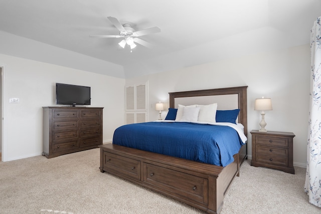 bedroom with light carpet and ceiling fan