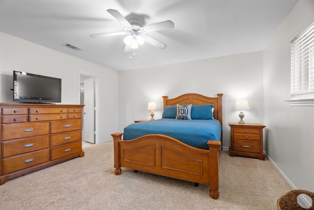 bedroom featuring ceiling fan and light colored carpet