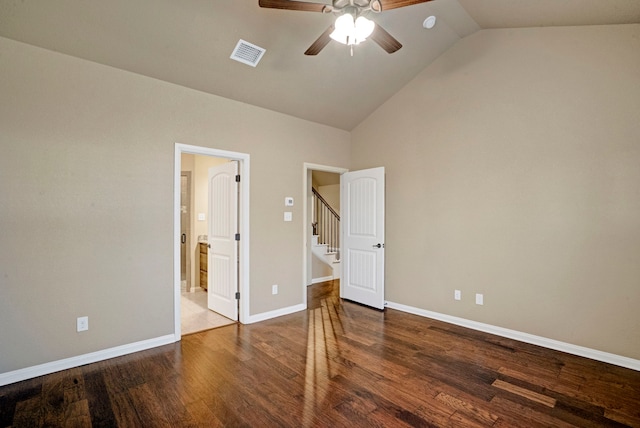 unfurnished bedroom with dark wood-type flooring, ceiling fan, and vaulted ceiling