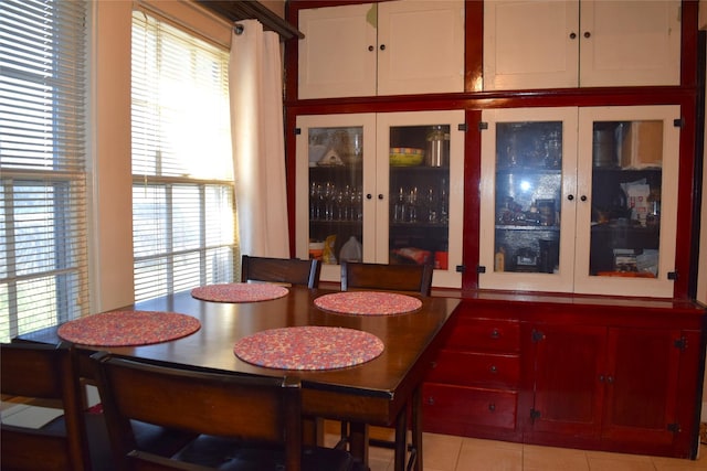 dining room featuring light tile patterned flooring