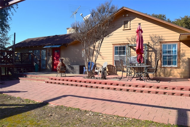 rear view of property featuring a patio