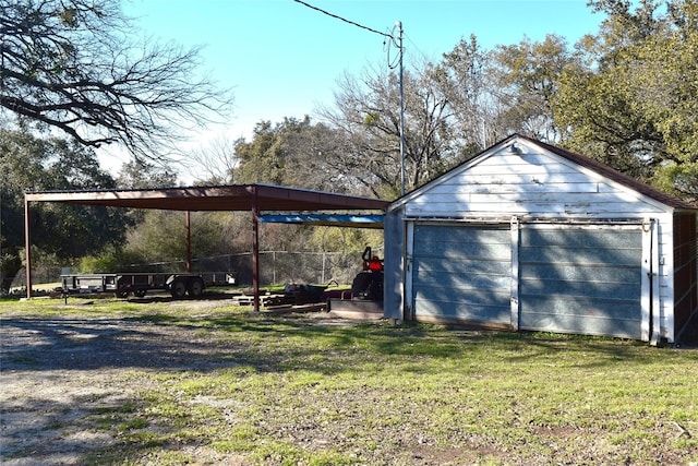 garage featuring a lawn