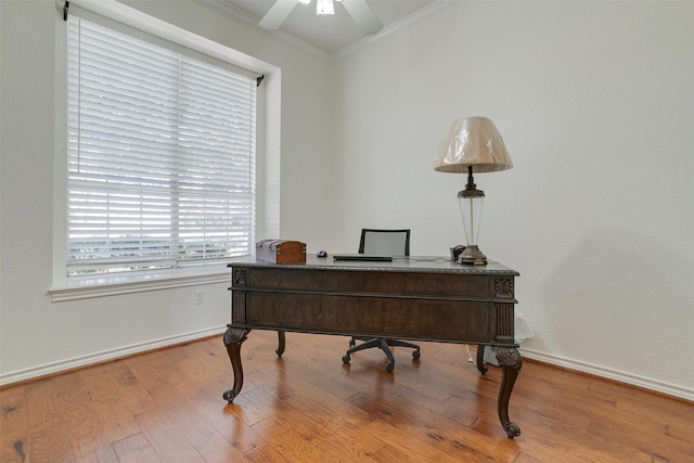 home office with hardwood / wood-style flooring, ceiling fan, and ornamental molding