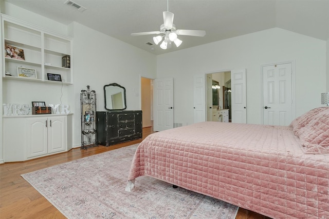 bedroom featuring wood-type flooring, vaulted ceiling, and ceiling fan