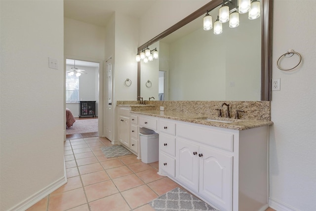 bathroom featuring ceiling fan, tile patterned flooring, and vanity