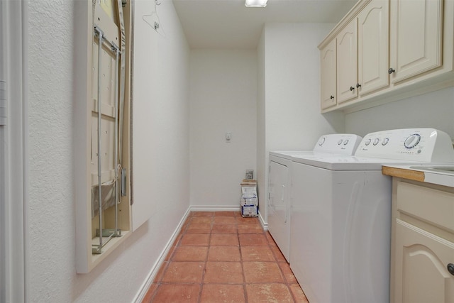 laundry area with separate washer and dryer, light tile patterned floors, and cabinets