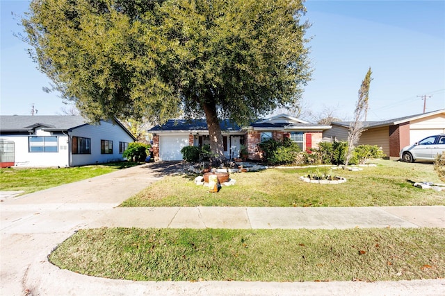 ranch-style home featuring a front yard and a garage