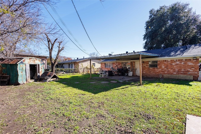 view of yard with a patio area and a storage shed