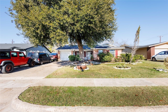 ranch-style home featuring a garage and a front lawn