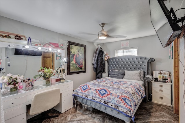 bedroom featuring ceiling fan and dark parquet floors