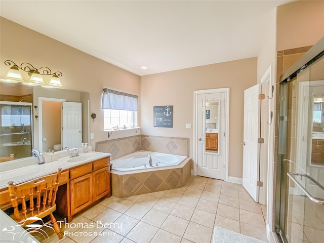 full bathroom with tile patterned floors, vanity, independent shower and bath, and toilet