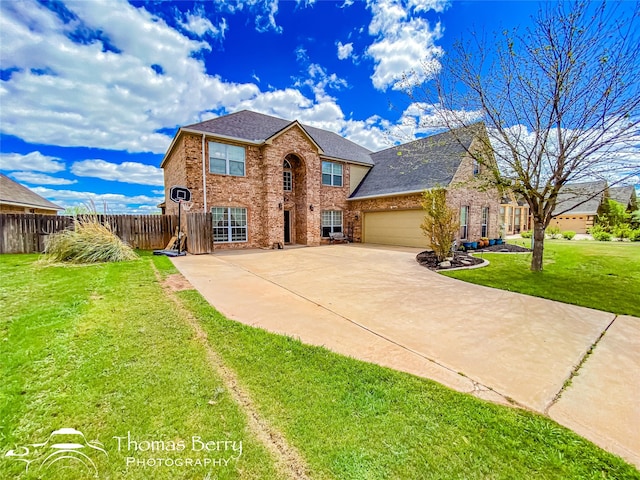 view of front facade with a garage and a front yard