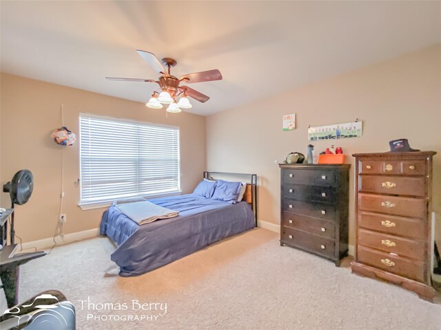 carpeted bedroom with ceiling fan