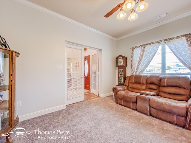 carpeted living room with crown molding and ceiling fan