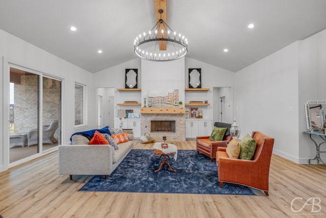 living room featuring a notable chandelier, light hardwood / wood-style floors, and lofted ceiling