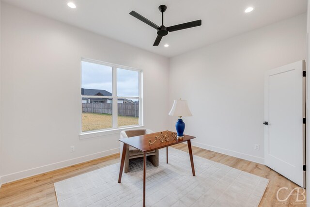 office space featuring ceiling fan and light hardwood / wood-style flooring