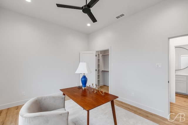 office featuring light hardwood / wood-style flooring and ceiling fan