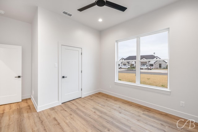 unfurnished room with light hardwood / wood-style floors and ceiling fan